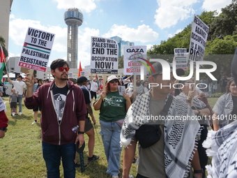 Hundreds of people join a demonstration in solidarity with the Palestinian people at The Grassy Knoll to mark the first anniversary of the w...