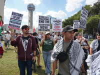 Hundreds of people join a demonstration in solidarity with the Palestinian people at The Grassy Knoll to mark the first anniversary of the w...