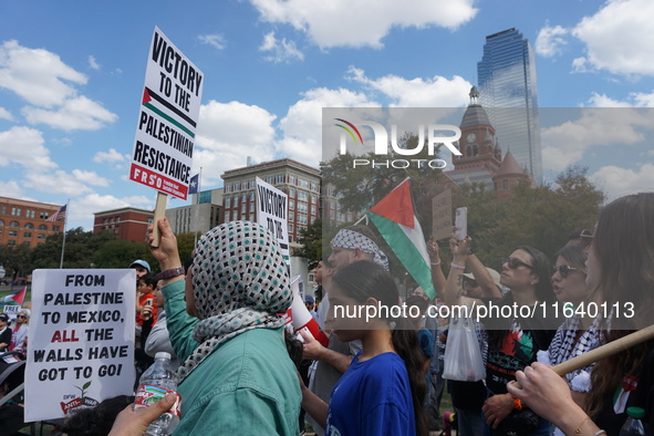 Hundreds of people join a demonstration in solidarity with the Palestinian people at The Grassy Knoll to mark the first anniversary of the w...