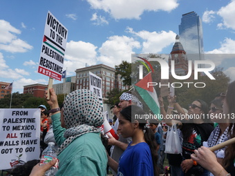 Hundreds of people join a demonstration in solidarity with the Palestinian people at The Grassy Knoll to mark the first anniversary of the w...