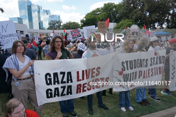 Hundreds of people join a demonstration in solidarity with the Palestinian people at The Grassy Knoll to mark the first anniversary of the w...