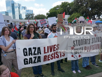 Hundreds of people join a demonstration in solidarity with the Palestinian people at The Grassy Knoll to mark the first anniversary of the w...