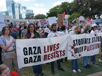 Hundreds of people join a demonstration in solidarity with the Palestinian people at The Grassy Knoll to mark the first anniversary of the w...