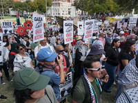 Hundreds of people join a demonstration in solidarity with the Palestinian people at The Grassy Knoll to mark the first anniversary of the w...