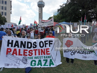 Hundreds of people join a demonstration in solidarity with the Palestinian people at The Grassy Knoll to mark the first anniversary of the w...