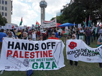 Hundreds of people join a demonstration in solidarity with the Palestinian people at The Grassy Knoll to mark the first anniversary of the w...