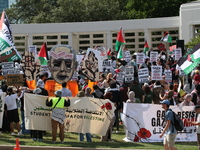 Hundreds of people join a demonstration in solidarity with the Palestinian people at The Grassy Knoll to mark the first anniversary of the w...