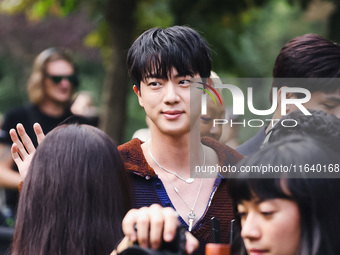 Jin of BTS attends the Gucci Fashion Show during the Milan Womenswear Spring/Summer 2025 in Milan, Italy, on September 27, 2024 (