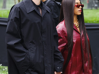 Simon Davis and Kelsey Lu attend the Gucci Fashion Show during the Milan Womenswear Spring/Summer 2025 in Milan, Italy, on September 27, 202...