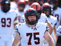 Princeton Tigers players come out on the field before the start of the NCAA football game against the Columbia Lions at Robert K. Kraft Fiel...