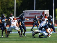 Princeton Tigers quarterback Blaine Hipa #15 is taken down by Columbia Lions defensive lineman Justin Townsend #36 during action in the NCAA...