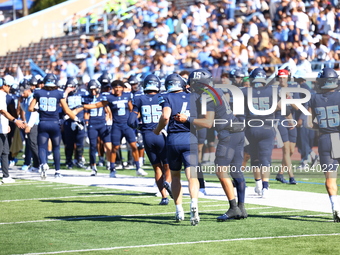 Columbia Lions quarterback Cole Freeman #4 celebrates a touchdown with teammates during the NCAA football game against the Princeton Tigers...