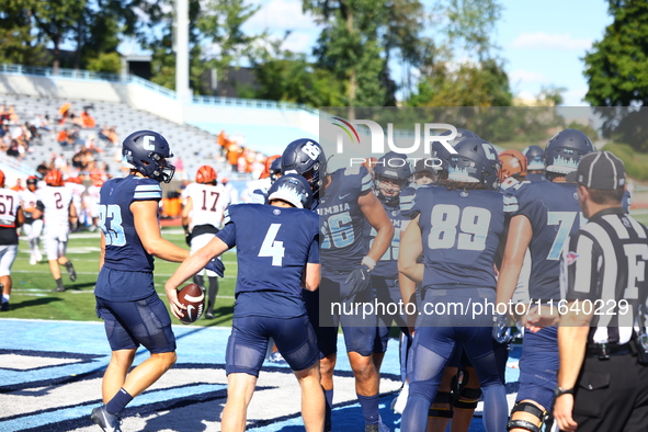 Columbia Lions quarterback Cole Freeman #4 celebrates a touchdown with teammates during the NCAA football game against the Princeton Tigers...