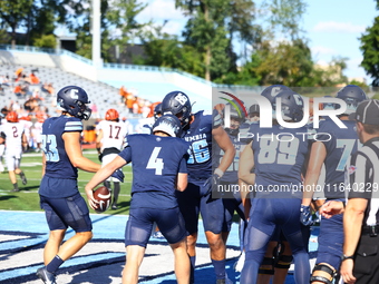 Columbia Lions quarterback Cole Freeman #4 celebrates a touchdown with teammates during the NCAA football game against the Princeton Tigers...