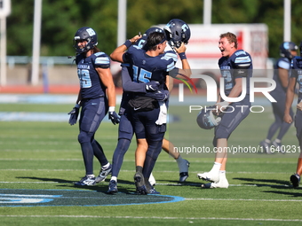 Columbia Lions quarterback Chase Goodwin #15 celebrates with teammates as time expires during the NCAA football game against the Princeton T...