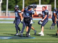 Columbia Lions quarterback Chase Goodwin #15 celebrates with teammates as time expires during the NCAA football game against the Princeton T...