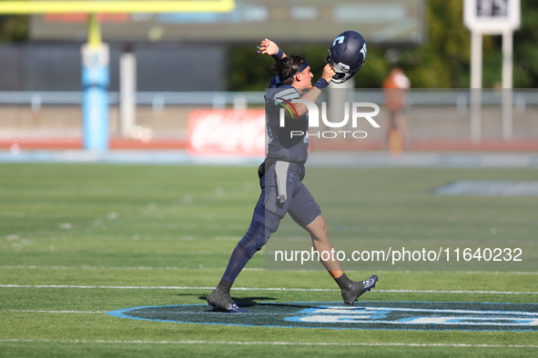 Columbia Lions quarterback Chase Goodwin #15 celebrates with teammates as time expires during the NCAA football game against the Princeton T...