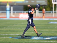 Columbia Lions quarterback Chase Goodwin #15 celebrates with teammates as time expires during the NCAA football game against the Princeton T...