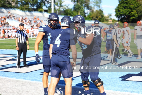 Columbia Lions quarterback Cole Freeman #4 celebrates a touchdown with teammates during the NCAA football game against the Princeton Tigers...