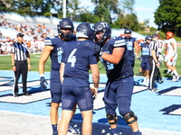 Columbia Lions quarterback Cole Freeman #4 celebrates a touchdown with teammates during the NCAA football game against the Princeton Tigers...