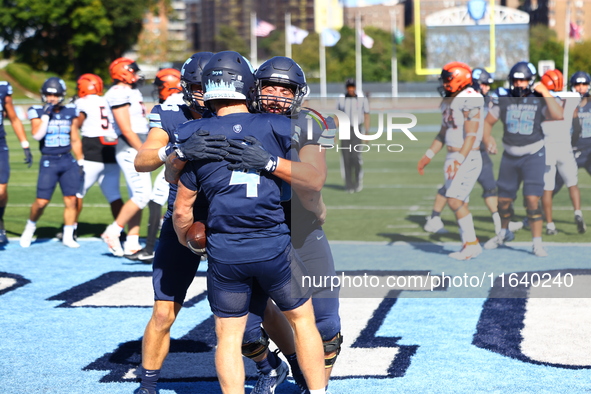 Columbia Lions quarterback Cole Freeman #4 celebrates a touchdown with teammates during the NCAA football game against the Princeton Tigers...