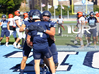 Columbia Lions quarterback Cole Freeman #4 celebrates a touchdown with teammates during the NCAA football game against the Princeton Tigers...