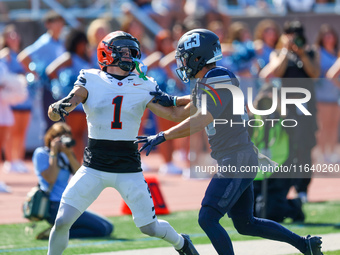 Princeton Tigers defensive back Casey Etienne Jr. #1 searches for the thrown ball in the end zone as Columbia Lions defensive back Carter Mc...