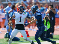 Princeton Tigers defensive back Casey Etienne Jr. #1 searches for the thrown ball in the end zone as Columbia Lions defensive back Carter Mc...