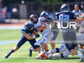 Princeton Tigers running back John Volker #2 is wrapped up by the Columbia defense during the NCAA football game against the Columbia Lions...