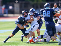 Princeton Tigers running back John Volker #2 is wrapped up by the Columbia defense during the NCAA football game against the Columbia Lions...