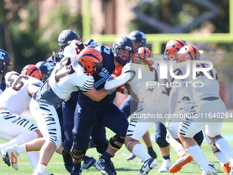 Columbia Lions offensive lineman Pat Colicchio #73 takes on multiple defenders during the NCAA football game against the Princeton Tigers at...