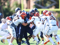 Columbia Lions offensive lineman Pat Colicchio #73 takes on multiple defenders during the NCAA football game against the Princeton Tigers at...