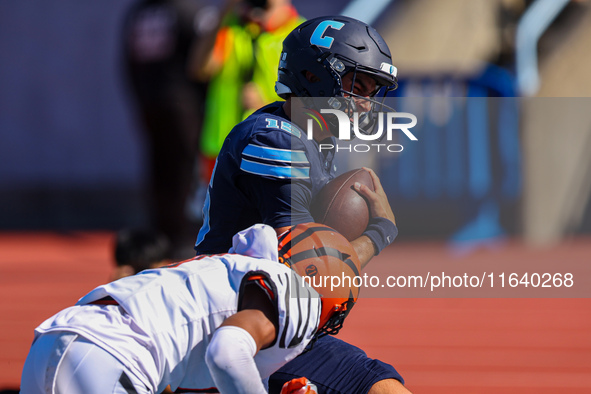 Columbia Lions quarterback Chase Goodwin #15 is hit by a defender as he goes in for a touchdown during the NCAA football game against the Pr...