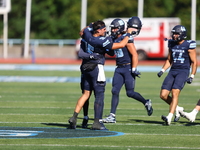 Columbia Lions quarterback Chase Goodwin #15 celebrates with teammates as time expires during the NCAA football game against the Princeton T...