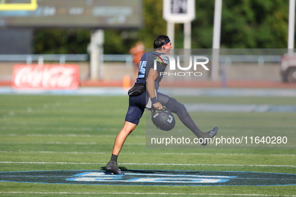 Columbia Lions quarterback Chase Goodwin #15 celebrates with teammates as time expires during the NCAA football game against the Princeton T...