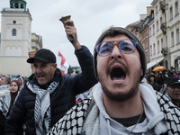 People take part in a protest in support of Palestine, in Warsaw, Poland, on October 5, 2024. Protesters march from the city center to the U...