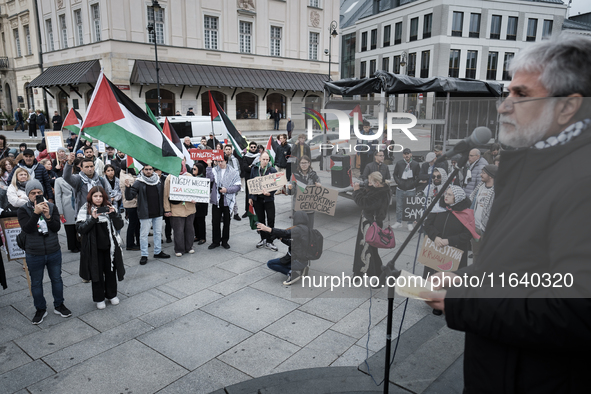 People take part in a protest in support of Palestine, in Warsaw, Poland, on October 5, 2024. Protesters march from the city center to the U...