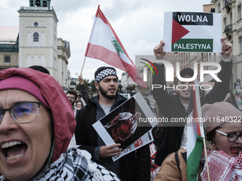 People take part in a protest in support of Palestine, in Warsaw, Poland, on October 5, 2024. Protesters march from the city center to the U...