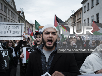 People take part in a protest in support of Palestine, in Warsaw, Poland, on October 5, 2024. Protesters march from the city center to the U...