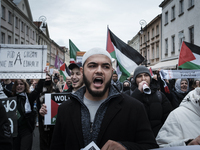 People take part in a protest in support of Palestine, in Warsaw, Poland, on October 5, 2024. Protesters march from the city center to the U...