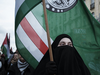 People take part in a protest in support of Palestine, in Warsaw, Poland, on October 5, 2024. Protesters march from the city center to the U...