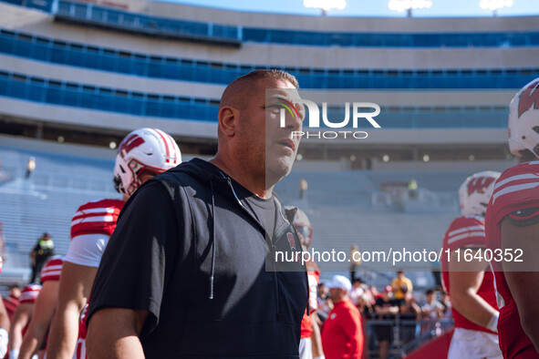 Wisconsin Badgers Offensive Coordinator Phil Longo walks out of the tunnel against the Purdue Boilermakers at Camp Randall Stadium in Madiso...