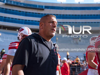 Wisconsin Badgers Offensive Coordinator Phil Longo walks out of the tunnel against the Purdue Boilermakers at Camp Randall Stadium in Madiso...