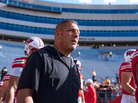 Wisconsin Badgers Offensive Coordinator Phil Longo walks out of the tunnel against the Purdue Boilermakers at Camp Randall Stadium in Madiso...