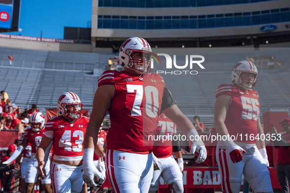 Wisconsin Badgers offensive lineman Barrett Nelson #70 walks out of the tunnel against the Purdue Boilermakers at Camp Randall Stadium in Ma...