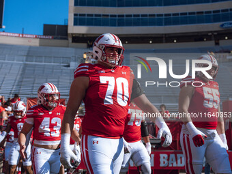 Wisconsin Badgers offensive lineman Barrett Nelson #70 walks out of the tunnel against the Purdue Boilermakers at Camp Randall Stadium in Ma...