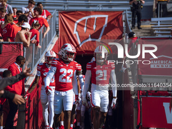 The Wisconsin Badgers walk out of the tunnel against the Purdue Boilermakers at Camp Randall Stadium in Madison, Wisconsin, on October 5, 20...