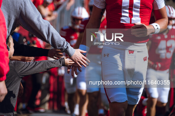 The Wisconsin Badgers walk out of the tunnel against the Purdue Boilermakers at Camp Randall Stadium in Madison, Wisconsin, on October 5, 20...