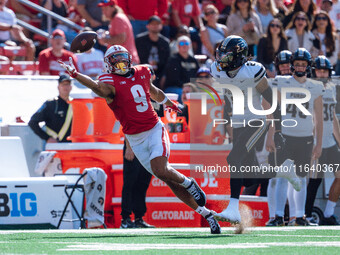 Wisconsin Badgers wide receiver Bryson Green #9 attempts to catch a pass just out of his reach against the Purdue Boilermakers at Camp Randa...