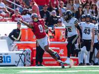 Wisconsin Badgers wide receiver Bryson Green #9 attempts to catch a pass just out of his reach against the Purdue Boilermakers at Camp Randa...